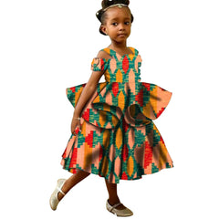 Young girl wearing a colorful patterned dress